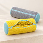 Yellow and grey EnthiraGlow shoe-washing bags with pale aqua zips and mesh ends; the yellow bag is open to show its tufted interior.