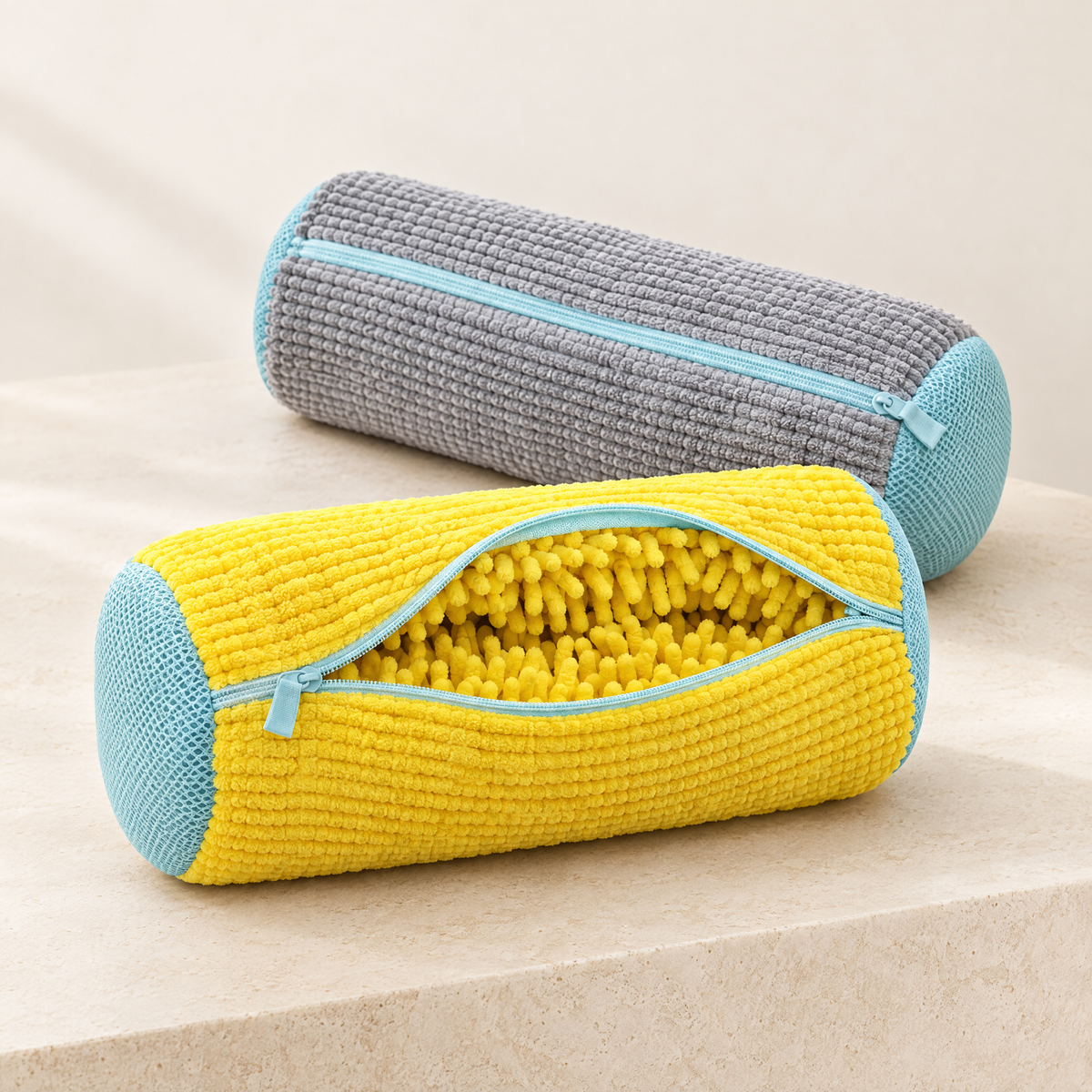 Yellow and grey EnthiraGlow shoe-washing bags with pale aqua zips and mesh ends; the yellow bag is open to show its tufted interior.